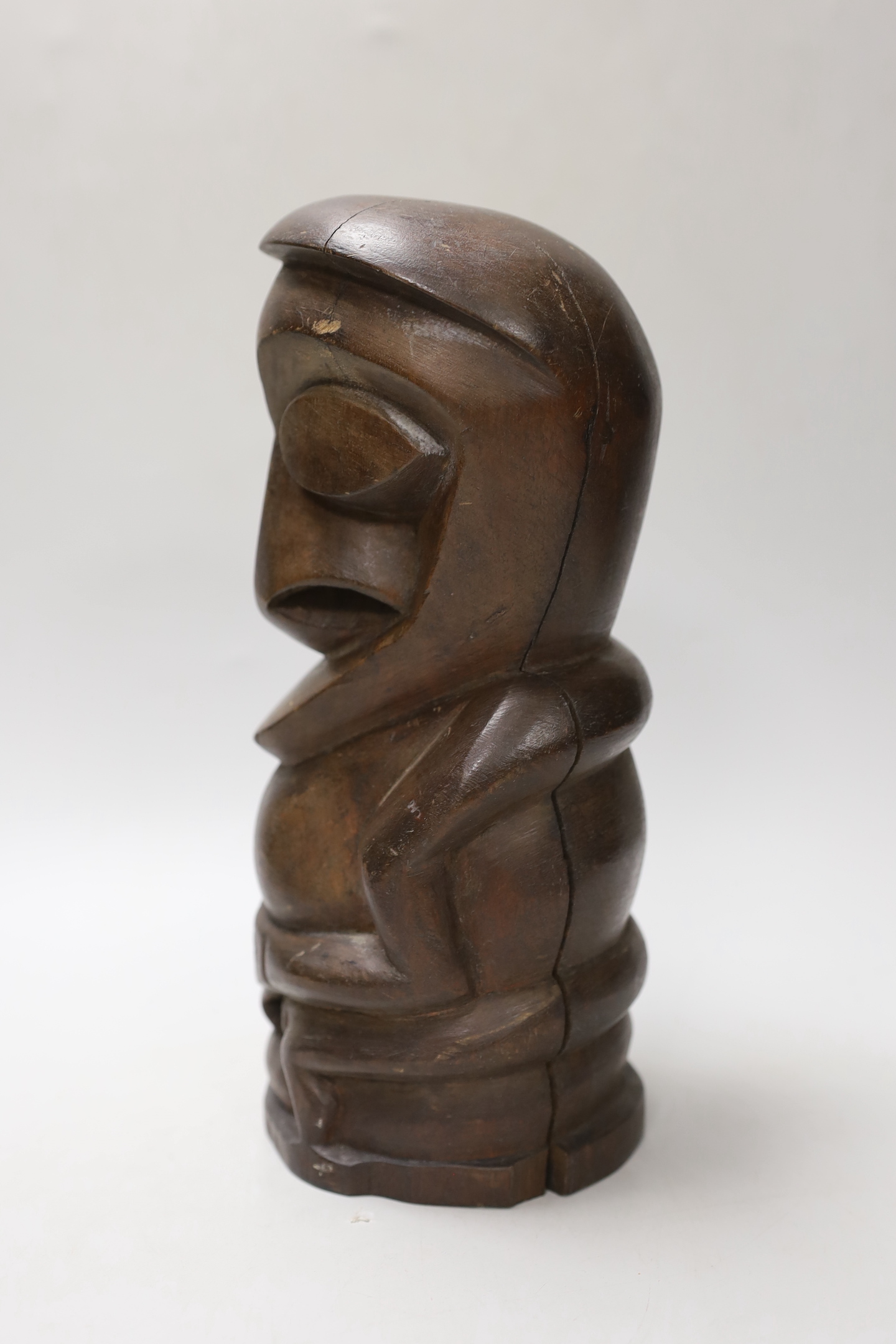 A Maori type carved hardwood totem figure, 26cm high